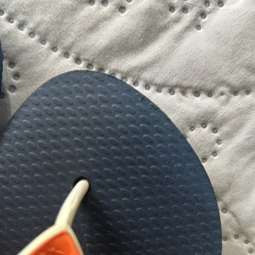 Havana’s flip flops size 29/30 (11-12). Navy base w/orange strap. Great shape!